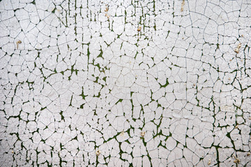 Texture of old peeling metal wall painted with white paint