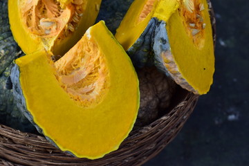 slices of pumpkin on black background