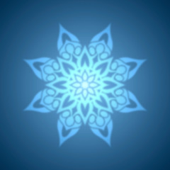 Abstract blue snowflake with blurred effect.