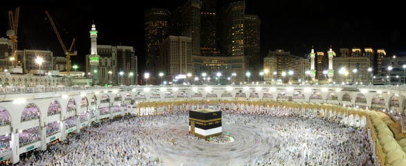 Muslim Pilgrims at The Kaaba in The Haram Mosque of Mecca , Saudi Arabia, In the night during Hajj.