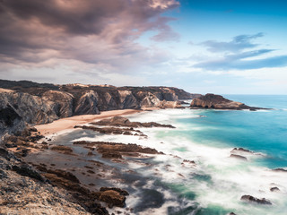 27/09-18, Zambujeira do Mar, Portugal. View over a beautiful sand beach. A storm is forming over land.