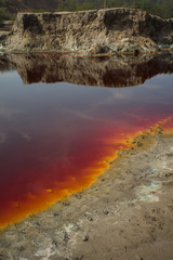 Rainbow colored polluted water