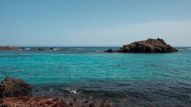 Pristine lagoons at the natural reserve of the island of Los Lobos, a small isle located north of the island of Fuerteventura, visited by a limited number of tourists daily, in Canary Islands, Spain