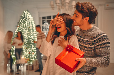 Group of friends celebrating Christmas at home