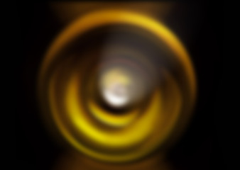 Abstract background of yellow spin radial motion blur.