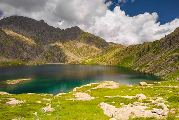 French Alps at an altitude of 2800 meters, Mountain peaks and untouched nature, clear lakes