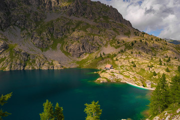 Fototapeta na wymiar French Alps at an altitude of 2800 meters, Mountain peaks and untouched nature, clear lakes