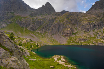 Naklejka na ściany i meble French Alps at an altitude of 2800 meters, Mountain peaks and untouched nature, clear lakes