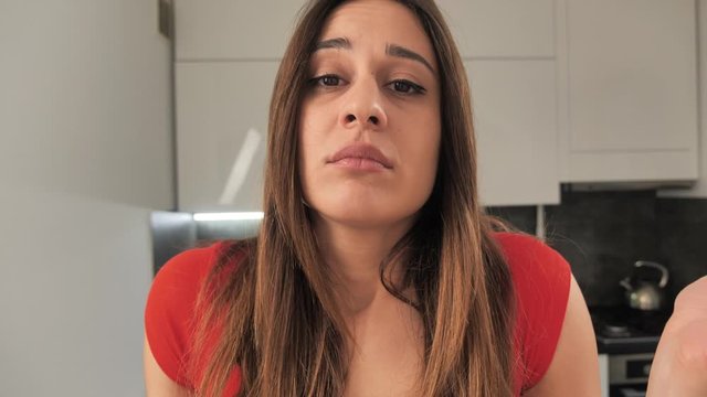 Uneasy, troubled girl sighing, touching face and frowning upset, regret, missing lifetime opportunity, grieving, feeling discomfort and frustration, on kitchen background