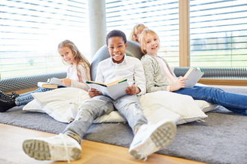 Group of kids reading relaxed