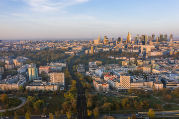Fototapeta na wymiar Warsaw, Poland. City landscape at sunrise. Aerial view of the river and the city with skyscrapers and buildings in the early morning.