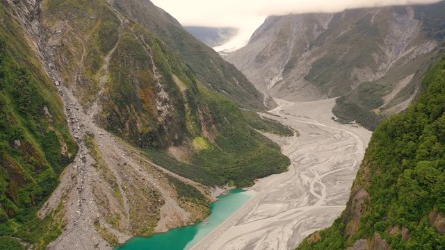 Aerial view of scenic Fox Glacier at the mountain range, New Zealand.