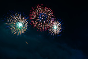 Abstract and brightly colorful firework in the celebration and anniversary festival.Merry Christmas and New year party light over night sky.