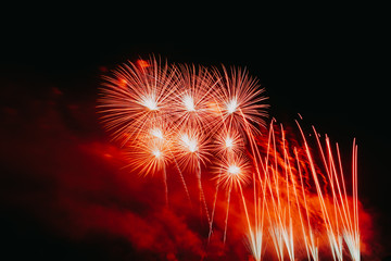 Abstract and brightly colorful firework in the celebration and anniversary festival.Merry Christmas and New year party light over night sky.