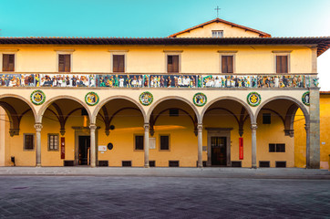 Pistoia old Ceppo hospital palace front facade with beautiful decoration and arches