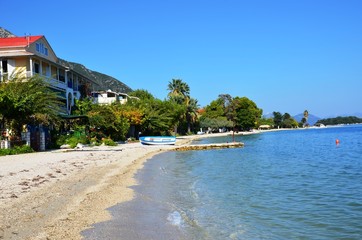 Nydri, Lefkada Island, Greece. 10/22/2019. buildings on the coast. beachfront apartments, beach without people