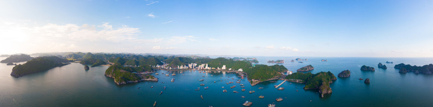 Aerial Unique View Vietnam Cat Ba Bay With Floating Fishing Boats On Sea, Cloudscape Tropical Weather Inspirational Sunset, Epic City Skyline And Skyscraper, Scenic Green Mountain.