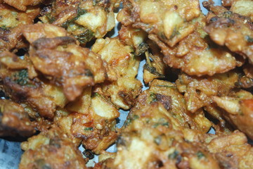 close-up view with selective focus of crispy basin pakora/pakoda or patties