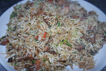 Cooked white Basmati rice pulao or biryani with chicken meat