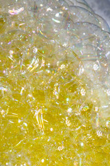 Close Up of Bath Water Bubbles Foam For Background In Yellow