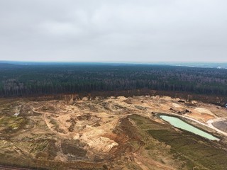 Sand mine next to forest. Drone footage.