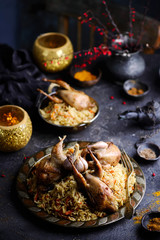 quail pilaf on the metallic plate