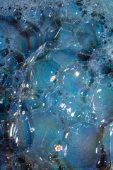 Fototapeta na wymiar Close Up of Bath Water Bubbles Foam For Background In Blue