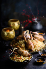 quail pilaf on the metallic plate