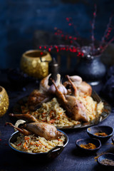 quail pilaf on the metallic plate