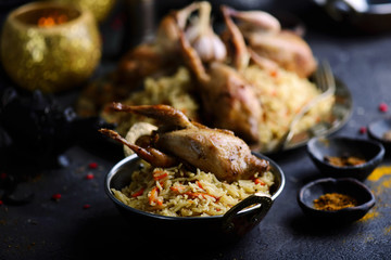 quail pilaf on the metallic plate