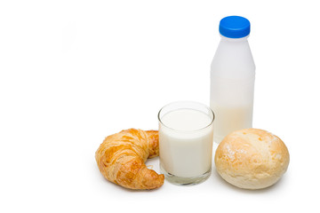 Pasteurized fresh milk in the glass with bread and plastic bottle on white background with clipping path.