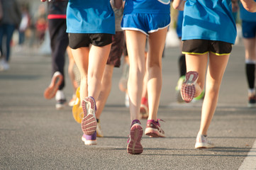 runners in black and blue sports pants