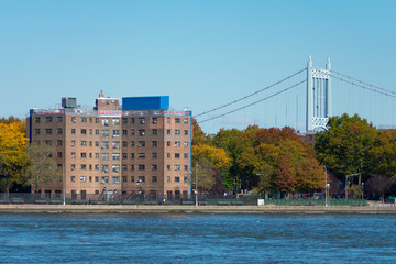 Shoreline of Astoria Queens New York with Public Housing Buildings and the East River with Colorful...