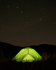 Solitude camping in the mountains under the stars