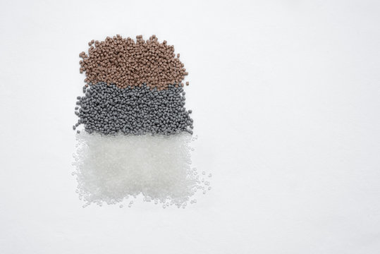 Granules of termoplastic elastomer on a white background