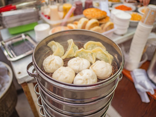 Close up Steamed Baozi or bun and dumpling the famous chinese cuisine in Breakfast restaurant at zhangjiajie Downtown alley district china.Hunan China.