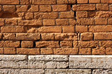 Surface of red and white antique bricks is close