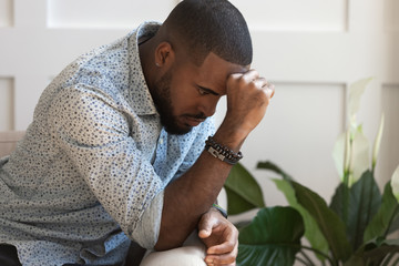 Pensive african American man thinking over problem
