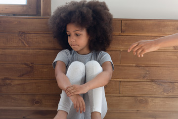 Offended biracial small girl feel hurt ignoring parent