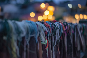 Obraz premium Prayer tags tied on the bridge in the Pilok mine village in kanchanaburi City Thailand.Pilok mine The Old mine near the Thai-Myanmar border