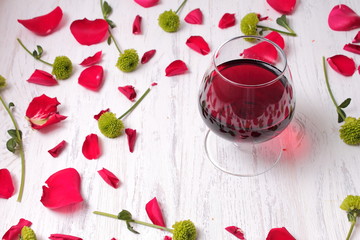 Glass of red wine on a wooden table