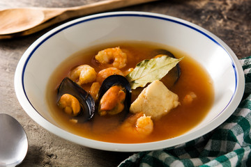 French bouillabaisse soup on wooden table