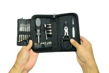 a hand of adult holding the black bag of multi purpose tool kit on white background