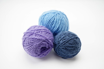 Fototapeta na wymiar Wool skeins for knitting isolated on a light background. Home needlework