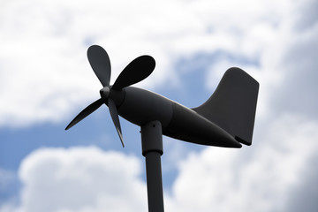 An indicator for the wind direction in form of an airplane nearby a pier in Nikko-Japan.