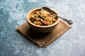 Oats Chivda / Chiwda is a healthy indian recipe with added chilli, peanuts, cashew, almond and...