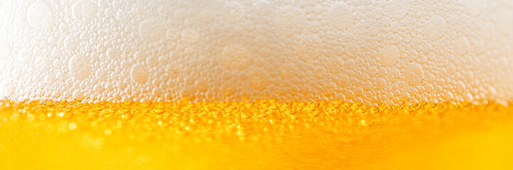 Light Beer with Bubbles and Foam Background. Beer Bubbles Texture Close Up