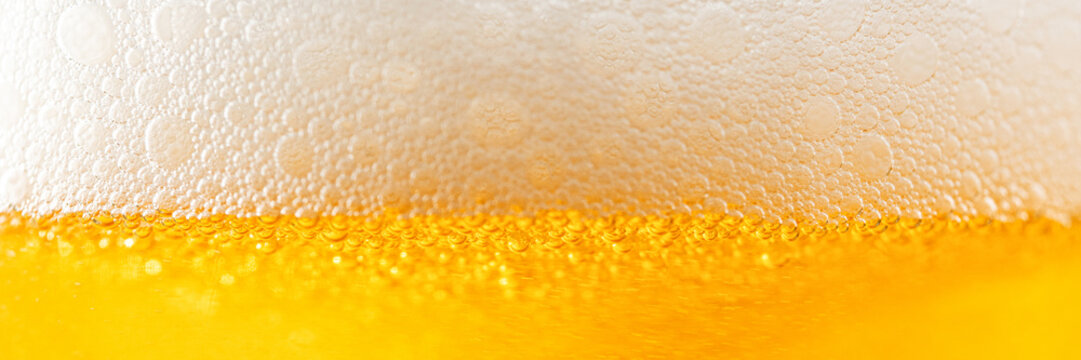 Light Beer With Bubbles And Foam Background. Beer Bubbles Texture Close Up