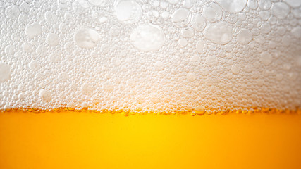 Light Beer with Bubbles and Foam Background. Beer Bubbles Texture Close Up