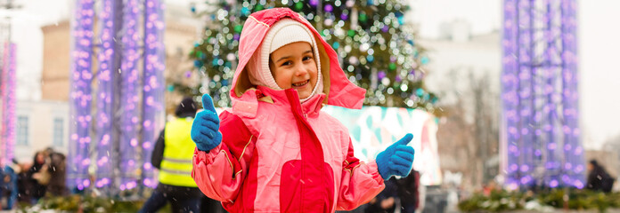 little girl outdoors at christmas time